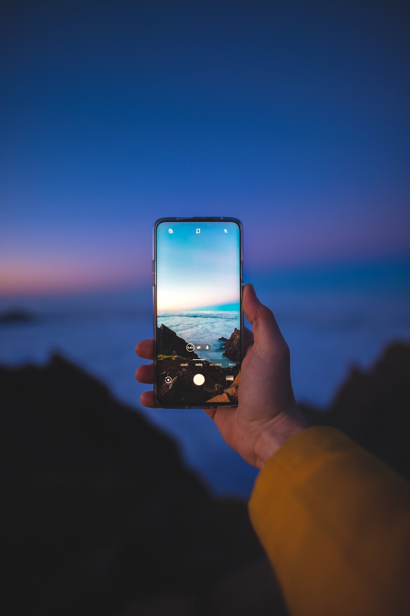 person holding black Android smartphone