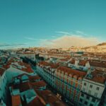 a panoramic view of a city with red roofs