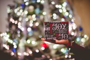 selective focus photography of gift box on person's palm